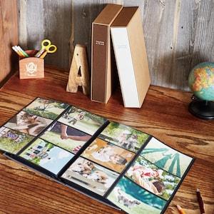 インテリアに馴染むボックス付き布張り表紙の折りたたみ写真アルバムの商品写真