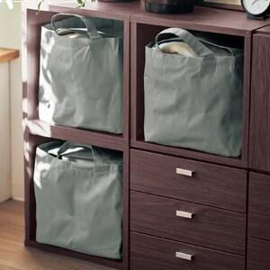 中身を覆えるフラップ付き持ち運びができる収納トートの商品写真